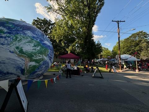 Visitors gather around the 16-foot Spaceship Earth globe and community activities during the 2026 Bucky's Birthday Block Party.