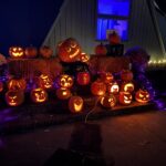 Glowing carved pumpkins displayed outside the Fuller Dome Home during the Jon Davey Dome Glow
