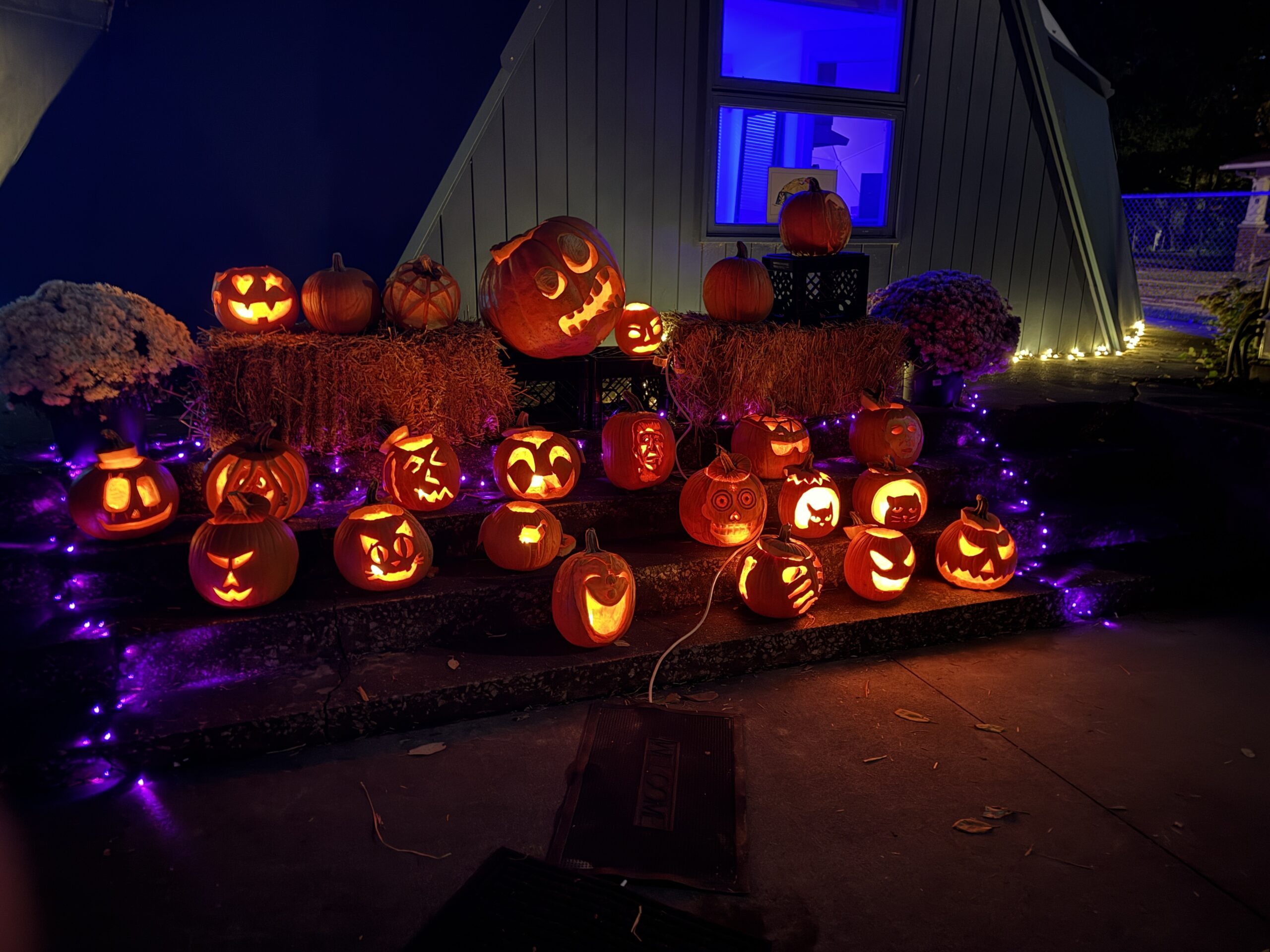 Glowing carved pumpkins displayed outside the Fuller Dome Home during the Jon Davey Dome Glow
